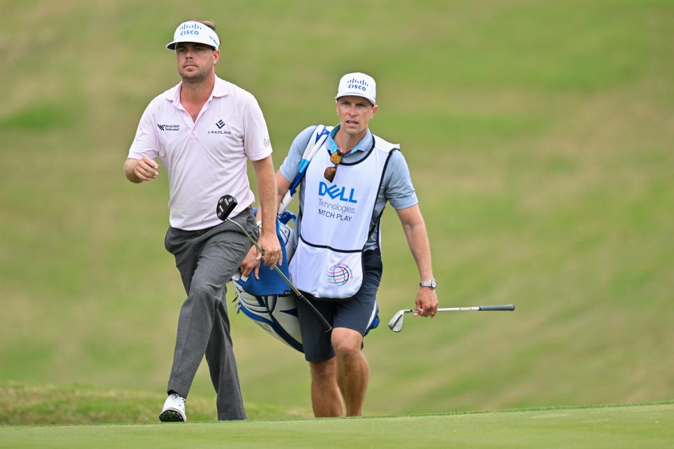 AUSTIN, TEXAS - MARCH 22: Keith Mitchell and his caddie walk along the 18th fairway during the first day of the World Golf Championships-Dell Technologies Match Play at Austin Country Club on March 22, 2023 in Austin, Texas. (Photo by Ben Jared/PGA TOUR via Getty Images)