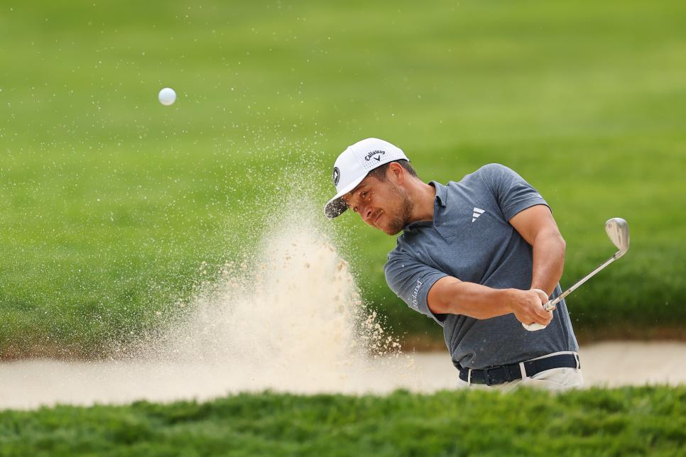 ROCHESTER, NEW YORK - MAY 16: Xander Schauffele of the United States plays a shot from a bunker on the practice range during a practice round prior to the 2023 PGA Championship at Oak Hill Country Club on May 16, 2023 in Rochester, New York. (Photo by Michael Reaves/Getty Images)