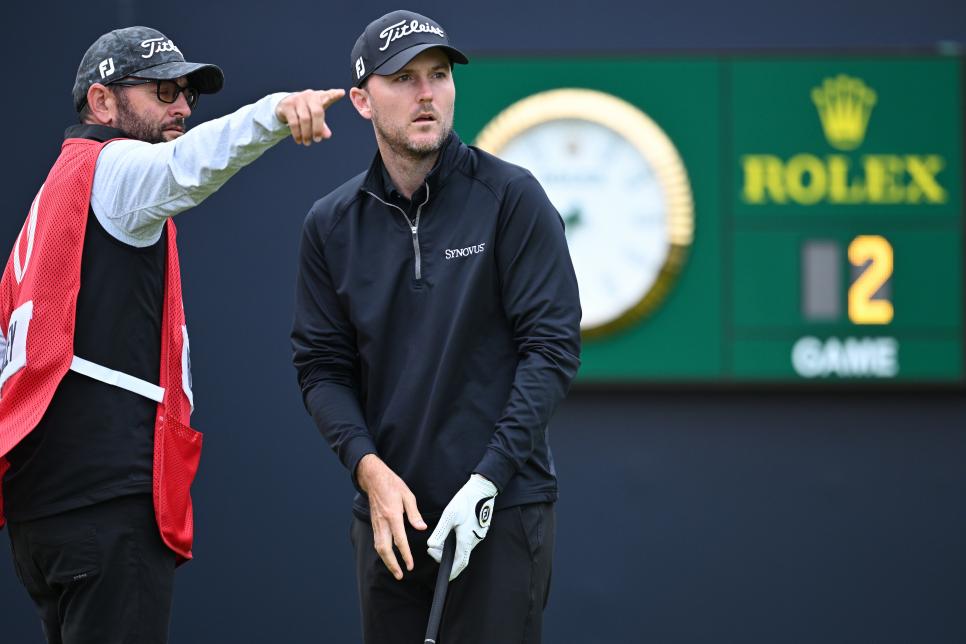 HOYLAKE, ENGLAND - JULY 20: Russell Henley of the United States interacts with their caddy on the 1st during Day One of The 151st Open at Royal Liverpool Golf Club on July 20, 2023 in Hoylake, England. (Photo by Stuart Franklin/R&A/R&A via Getty Images)