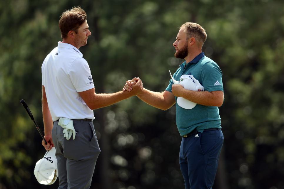 AUGUSTA, GEORGIA - APRIL 08: Sam Burns (L) and Tyrrell Hatton of England shake hands on the 18th green after finishing their round during the second round of The Masters at Augusta National Golf Club on April 08, 2022 in Augusta, Georgia. (Photo by Andrew Redington/Getty Images)