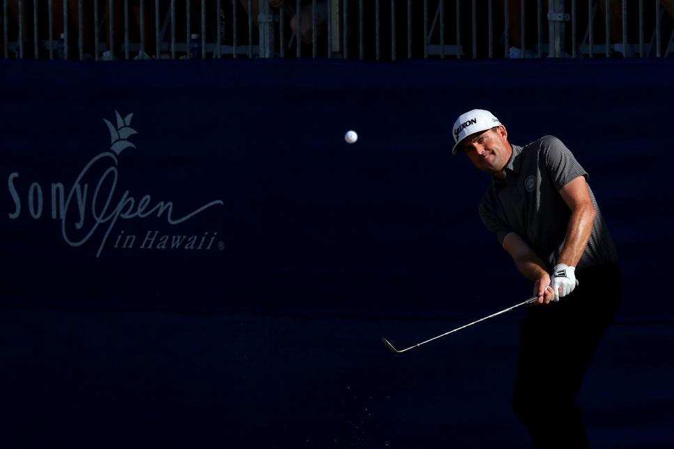 HONOLULU, HAWAII - JANUARY 14: Keegan Bradley of the United States takes a shot on the 18th green during the first playoff hole against Grayson Murray of the United States and Byeong Hun An of South Korea of the Sony Open in Hawaii at Waialae Country Club on January 14, 2024 in Honolulu, Hawaii. (Photo by Kevin C. Cox/Getty Images)
