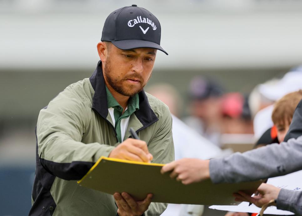 LOUISVILLE, KENTUCKY - MAY 14: Xander Schauffele of the United States signs autographs during a practice round prior to the 2024 PGA Championship at Valhalla Golf Club on May 14, 2024 in Louisville, Kentucky. (Photo by Andy Lyons/Getty Images)