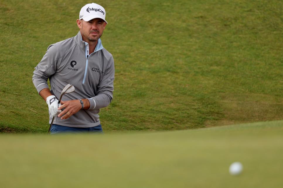 TROON, SCOTLAND - JULY 19: Brian Harman of the United States plays a bunker shot on the eighth green during day two of The 152nd Open championship at Royal Troon on July 19, 2024 in Troon, Scotland. (Photo by Kevin C. Cox/Getty Images)