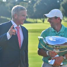 ATLANTA, GA - AUGUST 28: PGA Commissioner Jay Monahan (left) laughs with Rory McIlroy (right) after McIlroy won the PGA Tour Championship on Sunday, August 28, 2022  at East Lake Golf Club in Atlanta, GA. (Photo by Austin McAfee/Icon Sportswire via Getty Images)