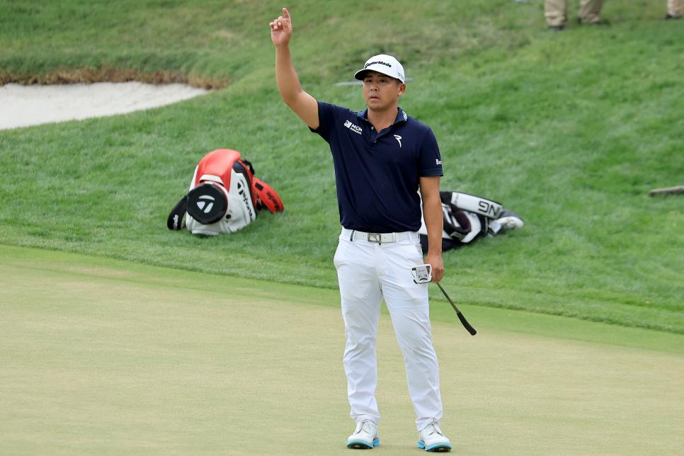 ORLANDO, FLORIDA - MARCH 05: Kurt Kitayama of The United States salutes the crowds as his long putt came to rest less than an inch from the hole on the 18th green to secure his one shot win during the final round of the Arnold Palmer Invitational presented by Mastercard at Arnold Palmer's Bay Hill and Lodge on March 05, 2023 in Orlando, Florida. (Photo by David Cannon/Getty Images)