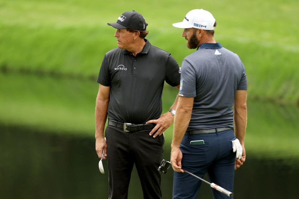 AUGUSTA, GEORGIA - NOVEMBER 10: Phil Mickelson of the United States talks to Dustin Johnson of the United States during a practice round prior to the Masters at Augusta National Golf Club on November 10, 2020 in Augusta, Georgia. (Photo by Patrick Smith/Getty Images)
