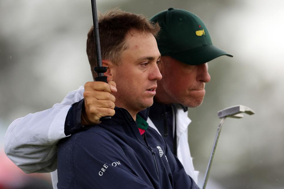 AUGUSTA, GEORGIA - APRIL 08: Justin Thomas of the United States and his caddie Jim 'Bones' Mackay react to his bogey on the 18th green during the continuation of the weather delayed second round of the 2023 Masters Tournament at Augusta National Golf Club on April 08, 2023 in Augusta, Georgia. (Photo by Christian Petersen/Getty Images)