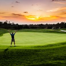 A silhouette of a golfer celebrating a made putt with a sunset.  http://blog.michaelsvoboda.com/GolfBanner.jpg