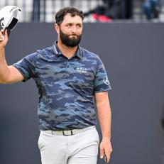 HOYLAKE, ENGLAND - JULY 22:  Jon Rahm of Spain tips his hat to fans after making a birdie putt on the 18th hole green to set an 8-under 63 course record during the third round of The 151st Open Championship at Royal Liverpool Golf Club on July 22, 2023 in Hoylake, England. (Photo by Keyur Khamar/PGA TOUR via Getty Images)