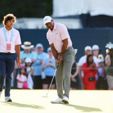 PINEHURST, NORTH CAROLINA - JUNE 11: Tiger Woods of the United States and son Charlie Woods walk on the practice green during a practice round prior to the U.S. Open at Pinehurst Resort on June 11, 2024 in Pinehurst, North Carolina. (Photo by Andrew Redington/Getty Images)