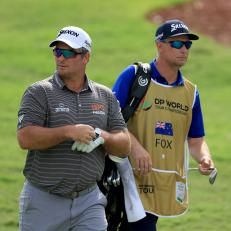 DUBAI, UNITED ARAB EMIRATES - NOVEMBER 16: Ryan Fox of New Zealand walks to his second shot on the third hole with his caddie Dean Smith during the first round on Day One of the DP World Tour Championship on the Earth Course at Jumeirah Golf Estates on November 16, 2023 in Dubai, United Arab Emirates. (Photo by David Cannon/Getty Images)