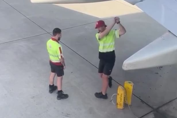 this-clip-of-two-airport-workers-practicing-their-swings-on-the-tarmac-is-the-feel-good-content-golf-needs-right-now