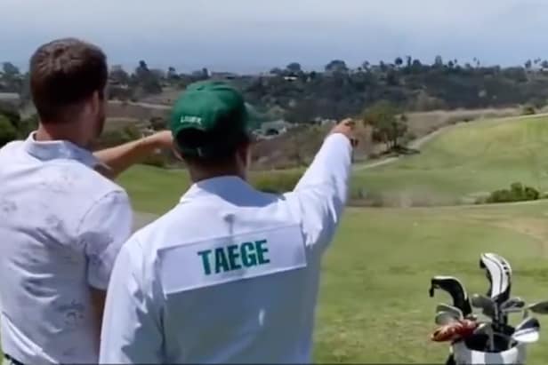 this-fantasy-football-league’s-last-place finisher has to-caddie-for-the-winner-in-a-masters-caddie-jumpsuit