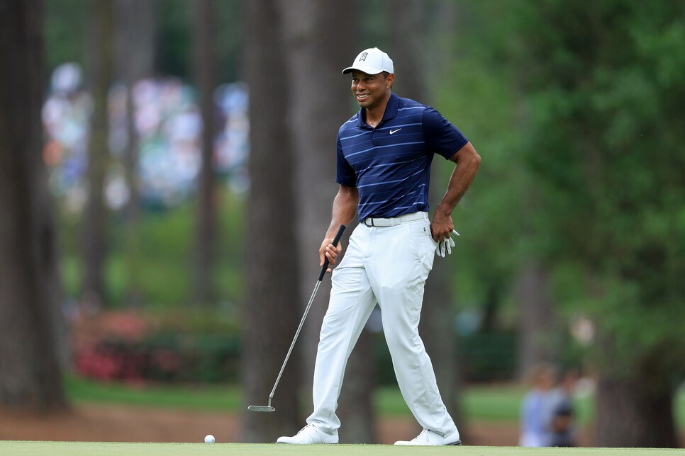 Masters suspends play Saturday; Tiger Woods in last place