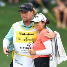 KUALA LUMPUR, MALAYSIA - OCTOBER 28: Rose Zhang of the United States hugs with her caddie after a birdie putt on the 18th green during the third round of the Maybank Championship at Kuala Lumpur Golf and Country Club on October 28, 2023 in Kuala Lumpur, Malaysia. (Photo by Yong Teck Lim/Getty Images)