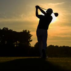 POTOMAC, MD - JULY 1:  Sung Kang of Korea is silhouetted as he hits balls on the practice range during sunset during the third round of the Quicken Loans National at TPC Potomac at Avenel Farm on July 1, 2017 in Potomac, Maryland. (Photo by Keyur Khamar/PGA TOUR)