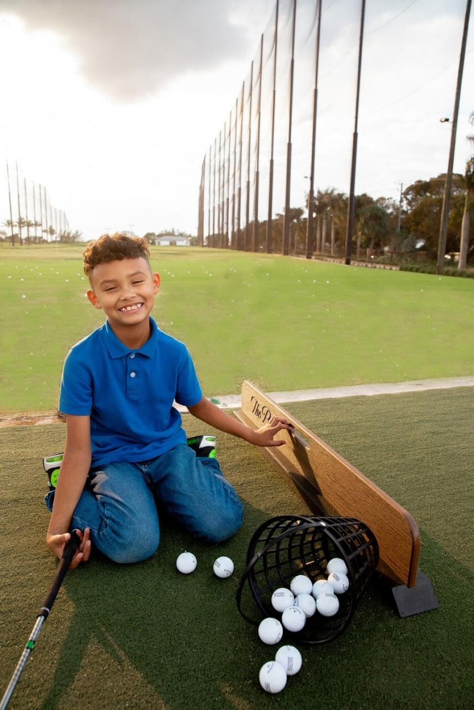 /content/dam/images/golfdigest/fullset/2024/2/kid-enjoying-golf-at-the-park.jpg