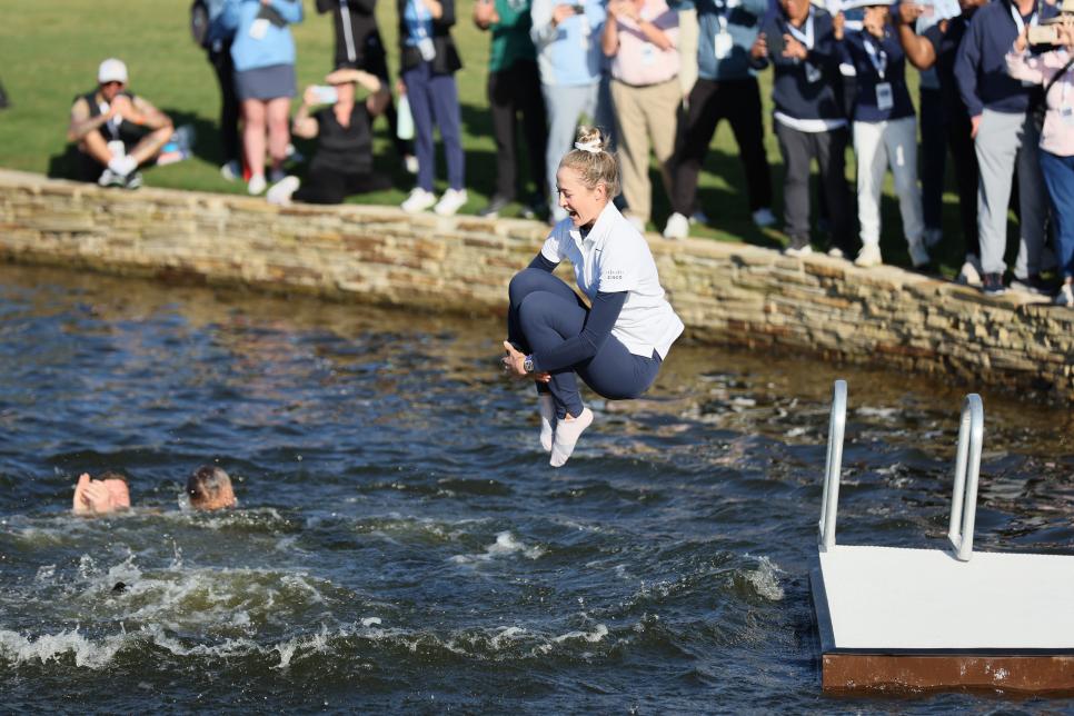THE WOODLANDS, TEXAS - APRIL 21: Nelly Korda of the United States jumps into the water after winning The Chevron Championship at The Club at Carlton Woods on April 21, 2024 in The Woodlands, Texas. (Photo by Andy Lyons/Getty Images)