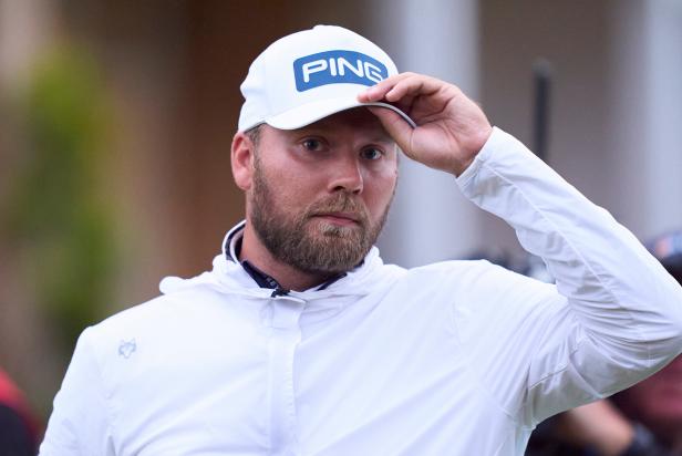 Daniel Brown appears to flick cigarette butt into Royal Troon fescue