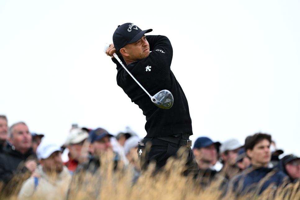 TROON, SCOTLAND - JULY 18: Xander Schauffele of the United States hits his shot from the fourth tee on day one of The 152nd Open championship at Royal Troon on July 18, 2024 in Troon, Scotland. (Photo by Luke Walker/R&A/R&A via Getty Images)