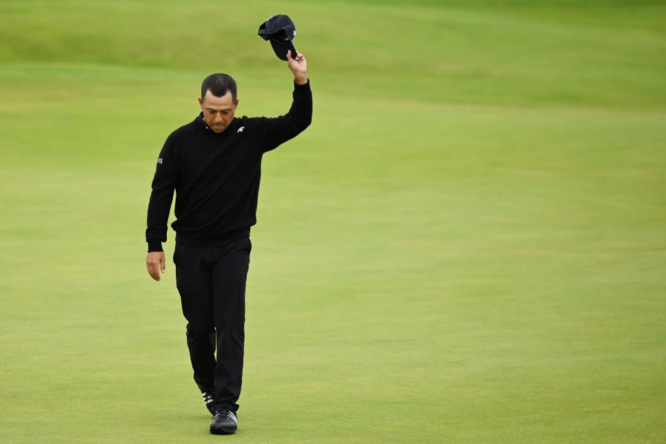 TROON, SCOTLAND - JULY 21: Xander Schauffele of the United States acknowledges the crowd on the 18th green on day four of The 152nd Open championship at Royal Troon on July 21, 2024 in Troon, Scotland. (Photo by Charlie Crowhurst/R&A/R&A via Getty Images)