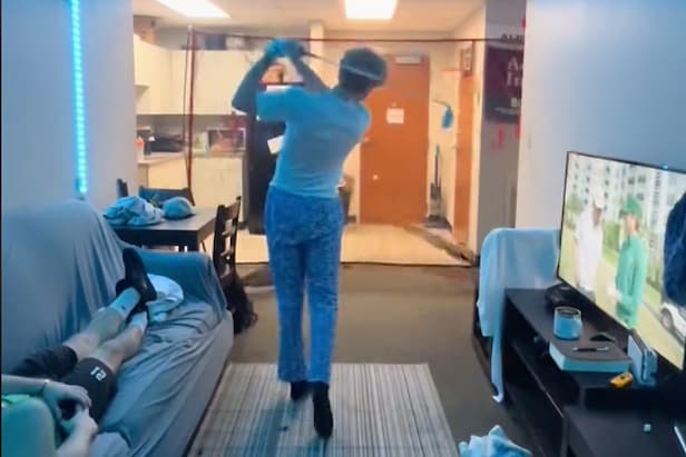 dudes-set-up-golf-practice-net-in-their-dorm-room,-are-living-the-college-dream