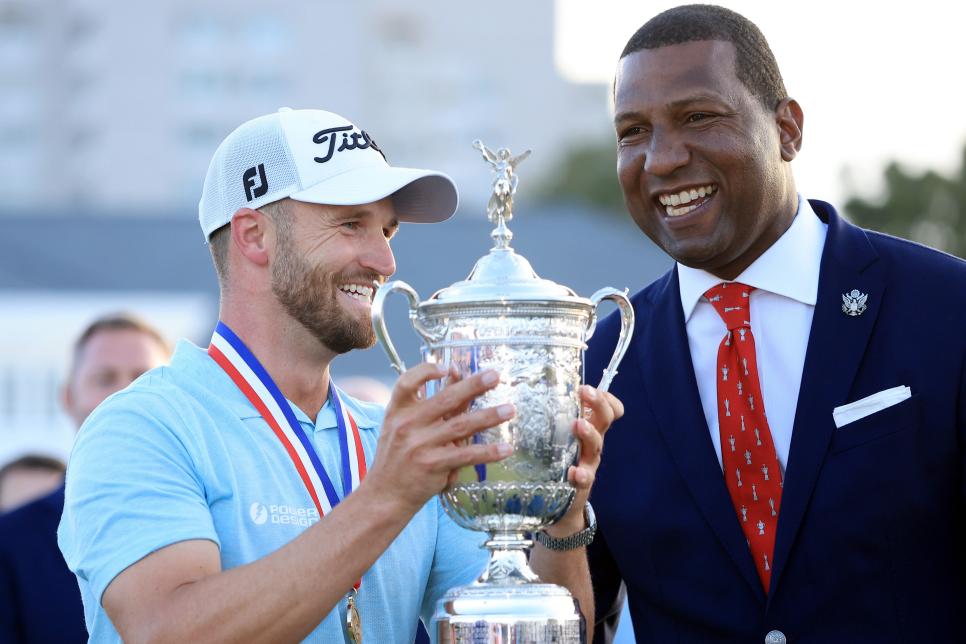 LOS ANGELES, CALIFORNIA - JUNE 18: Wyndham Clark of the United States receives the trophy from USGA President-elect Fred Perpall on the 18th green during the final round of the 123rd U.S. Open Championship at The Los Angeles Country Club on June 18, 2023 in Los Angeles, California. (Photo by Sean M. Haffey/Getty Images)