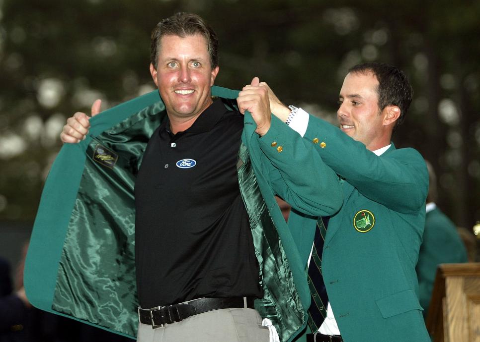 AUGUSTA, GA - APRIL 11:  Phil Mickelson of the U.S. is presented the green jacket by 2003 Masters champion Mike Weir of Canada after the final round of the Masters on April 11, 2004 at the Augusta National Golf Club in Augusta, Georgia.  (Photo by Harry How/Getty Images)
