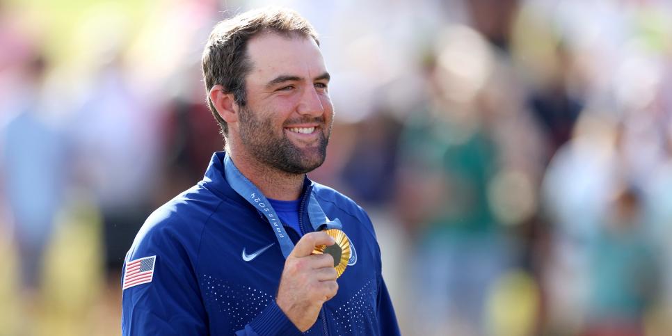 PARIS, FRANCE - AUGUST 04: Gold medalist, Scottie Scheffler of Team United States poses on the podium during the Men's Individual Stroke Play medal ceremony following Day Four of the Men's Individual Stroke Play on day nine of the Olympic Games Paris 2024 at Le Golf National on August 04, 2024 in Paris, France. (Photo by Andrew Redington/Getty Images)