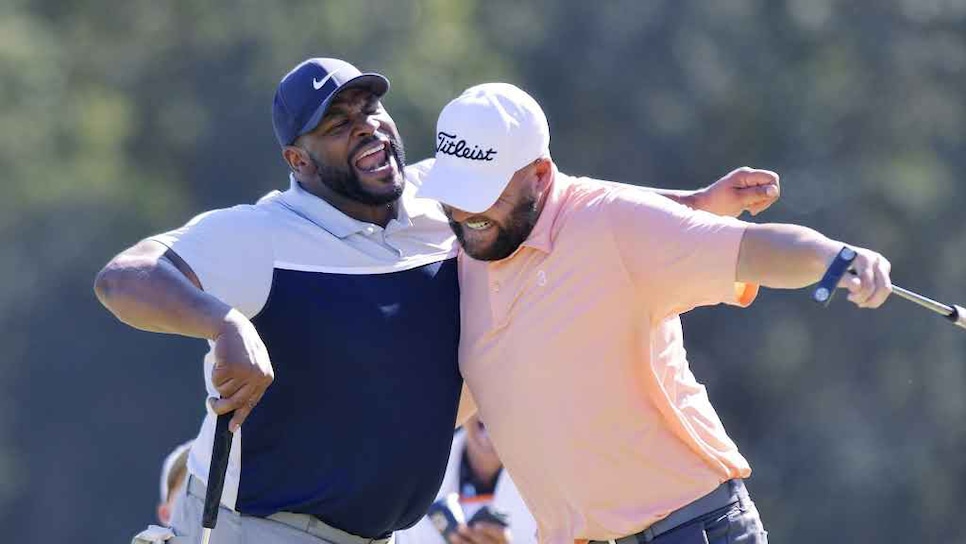 /content/dam/images/golfdigest/fullset/2025/12/golfers-chest-bump.jpg