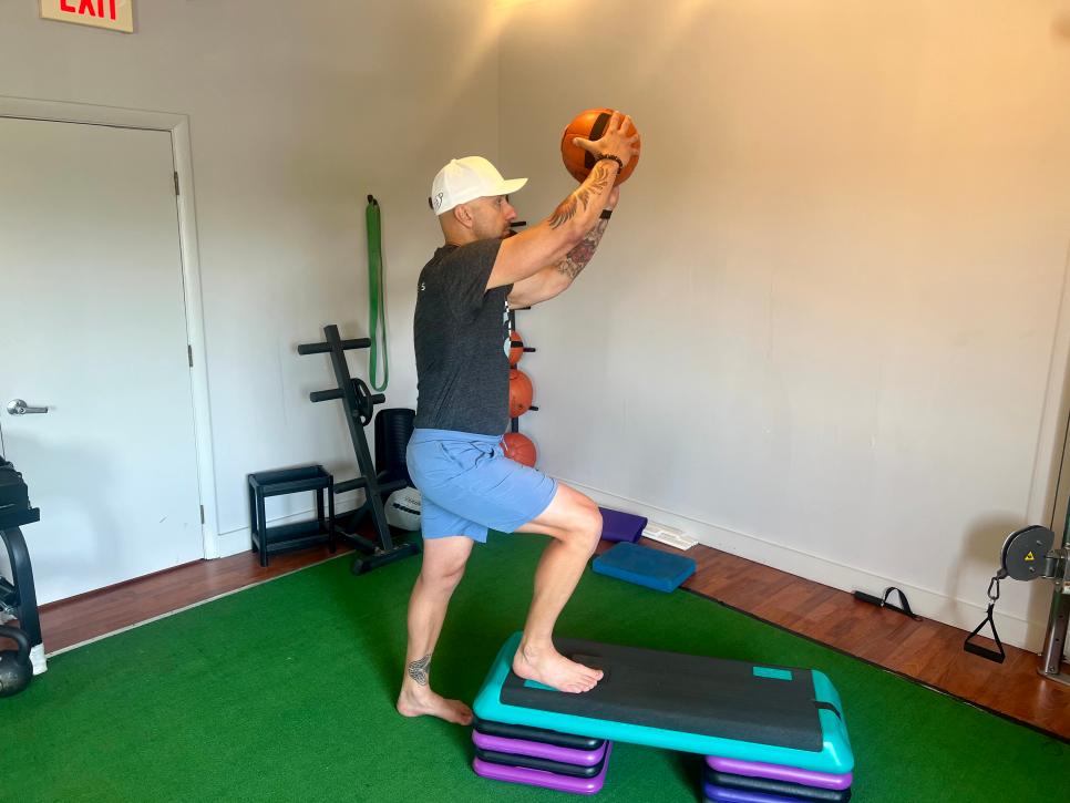 https://www.golfdigest.com/content/dam/images/golfdigest/fullset/fitness-2024/Gozbekian step-up with med-ball chop.jpeg