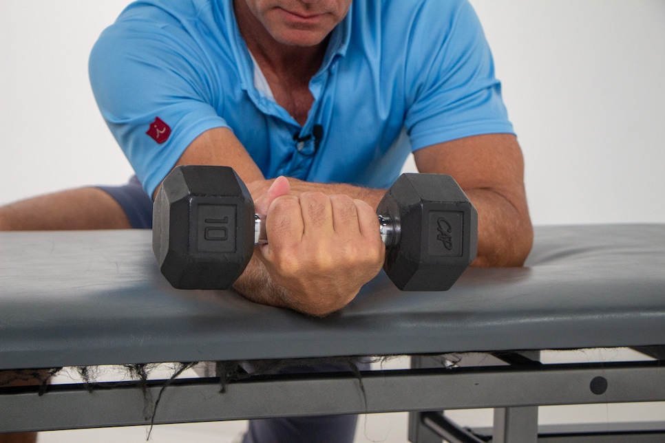 https://www.golfdigest.com/content/dam/images/golfdigest/fullset/fitness-2025/Hellman Wrist Flexion Finish.jpg