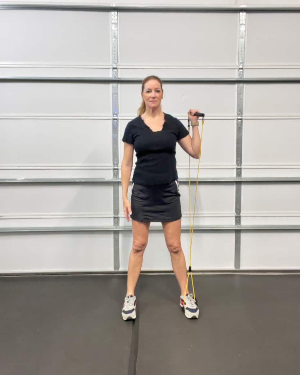 https://www.golfdigest.com/content/dam/images/golfdigest/fullset/fitness-2025/Jansen resistance band overhead reaches 1.jpeg