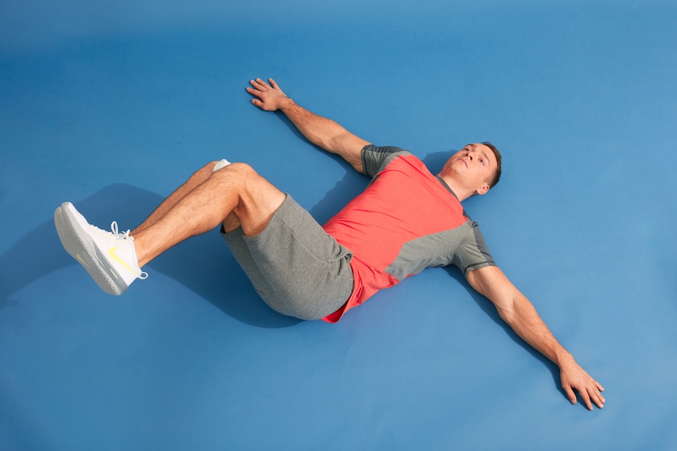 /content/dam/images/golfdigest/fullset/fitness-2026/Supine bent-leg hip rotations 4.jpg