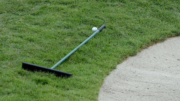 Rules of Golf Review: My ball is up against a bunker rake. Where do I play my next shot from?