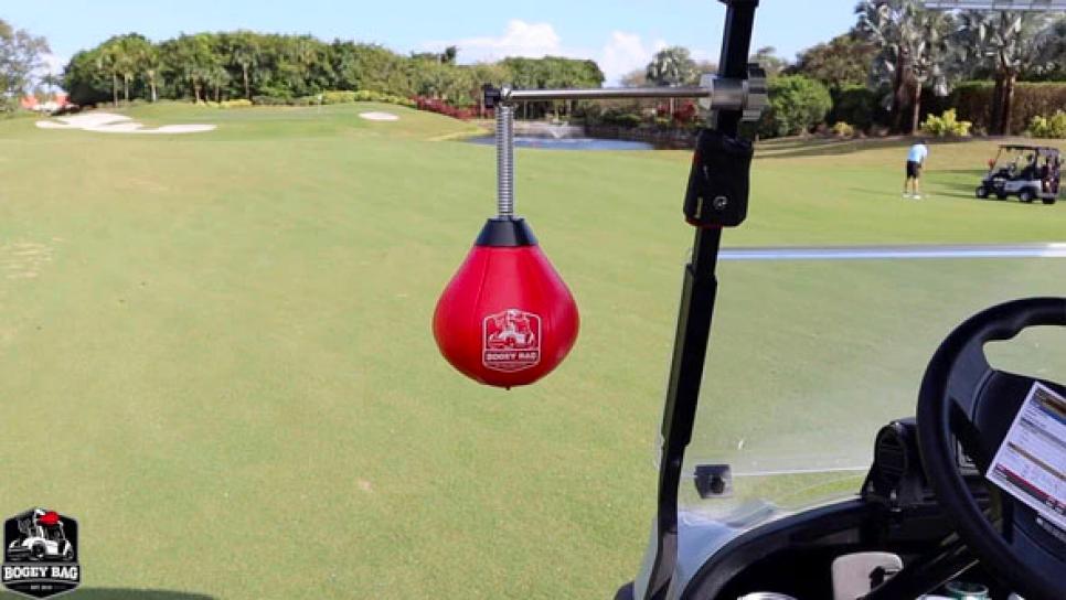 This hilariously clever punching bag golf cart attachment is the stress 